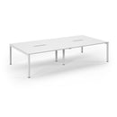 White Connex scalloped double back-to-back desks by Dams, showing a modern office workspace with sleek design and ample surface area.