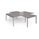 Dams Adapt Back to Back 4 Desk Cluster with Returns in Grey Oak finish, showing modern office workspace with ergonomic desks and returns.