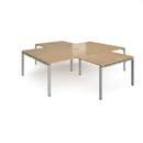 Dams Adapt Back to Back 4 Desk Cluster with Returns in Oak finish, showing spacious work surfaces and modern office design