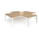Dams Adapt Back to Back 4 Desk Cluster with Returns in oak wood finish, showing desks arranged in a modern office workspace setup