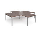 Dams Adapt Back to Back 4 Desk Cluster with Returns in Walnut wood finish, showing the workspace layout and desk surfaces.