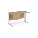 Dams Maestro 25 straight desk with 600mm depth, fixed 2-drawer pedestal, and cantilever legs, white finish.