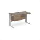 Dams Maestro 25 straight desk with 600mm depth, fixed 2-drawer pedestal, and cantilever legs, shown in white.