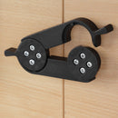 Black Dams meeting table linking device with secure TV lock mechanism for connecting and securing electronic displays.