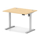 Dynamic Air Lite height adjustable desk with cable ports in maple finish, showing the sleek tabletop and cable management features.