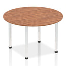 Dynamic Impulse round walnut table with post legs, showcasing smooth wooden surface and modern design.