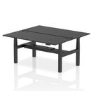 Black Dynamic Air 2-person back-to-back height adjustable bench desk with padded seats and sturdy metal frame.