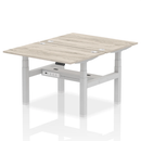 Dynamic Air 2 Person Back-to-Back Height Adjustable Desk Bench in Grey Oak, showing the ergonomic design and adjustable features.
