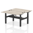 Grey oak adjustable back-to-back height bench desk for two people, featuring a sturdy design by Dynamic.