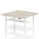 Two-person back-to-back height adjustable bench in grey oak with a sleek modern design, suitable for office or home use.