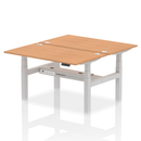 Dynamic Air 2-person back-to-back height adjustable oak bench desk showing the wooden surface and adjustable metal frame.