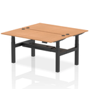Dynamic Air 2-person back-to-back height adjustable oak desk bench showing wooden surface and adjustable frame for office or gym use.