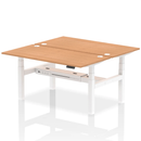 Two-tone oak-colored Dynamic Air 2-person back-to-back height adjustable bench desk with padded seats and adjustable height.