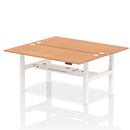 Dynamic Air 2-person back-to-back height adjustable oak desk bench showing sturdy wooden construction and ergonomic design.