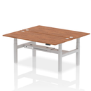 Dynamic Air 2 Person Back-to-Back Height Adjustable Walnut Desk Bench showing the wooden surface and adjustable metal frame
