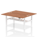 Dynamic Air 2-person back-to-back adjustable height bench desk in walnut wood, featuring a sturdy design and smooth height adjustment.