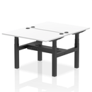 White Dynamic Air 2-person back-to-back height adjustable bench desk with sturdy metal frame and padded seats.