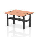 Dynamic Air 2-person back-to-back slimline height adjustable bench desk with beech finish, showing a modern ergonomic workspace.