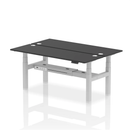 Black 2-person back-to-back slimline height adjustable bench desk by Dynamic, suitable for office or workout spaces