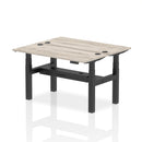 Gray oak adjustable back-to-back slimline bench desk with height adjustment, designed for two people, by Dynamic.