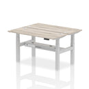 Grey oak Dynamic Air 2-person back-to-back slimline height adjustable bench desk with modern design and ergonomic features.