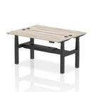 Grey oak adjustable back-to-back slimline bench desk for two, featuring height adjustment by Dynamic.