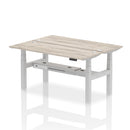Grey oak Dynamic Air 2-person back-to-back slimline height adjustable desk bench with modern design and sturdy construction.