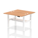 Dynamic Air 2 Person Back-to-Back Slimline Height Adjustable Oak Desk Bench showing sleek wooden surface and adjustable metal frame.