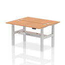 Dynamic Air 2-person back-to-back slimline height adjustable oak desk bench showing the modern, compact design and adjustable features.
