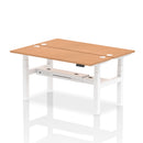 Dynamic Air 2 Person Back-to-Back Slimline Height Adjustable Oak Desk Bench showing a modern, space-saving office workspace setup.