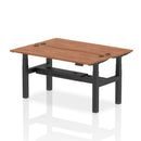 Dynamic Air 2-person back-to-back slimline height adjustable bench desk in walnut wood finish, showing the sleek modern design.