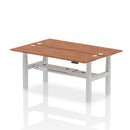 Dynamic Air 2 Person Back-to-Back Slimline Height Adjustable Walnut Desk Bench showing the sleek, modern wooden design and adjustable features.