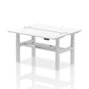White Air 2-person back-to-back slimline height adjustable desk bench by Dynamic, showing the modern, space-efficient design.