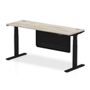 Grey oak adjustable height desk with steel modesty panel and cable ports by Dynamic, featuring 600mm depth and modern office design.
