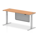 Height adjustable oak desk with 600mm depth, steel modesty panel, cable ports, and modern design by Dynamic.
