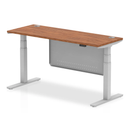 Dynamic Air 600mm deep height-adjustable walnut desk with cable ports and steel modesty panel, showing its modern design.