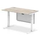 Grey oak Air 800mm deep height adjustable desk by Dynamic with cable ports and steel modesty panel, shown from side view