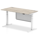 Grey oak Air 800mm deep height adjustable desk by Dynamic with cable ports and steel modesty panel, showing adjustable height mechanism.