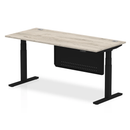 Dynamic Air 800mm deep height adjustable desk in grey oak with cable ports and steel modesty panel, shown from side angle.