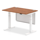 Dynamic Air 800mm deep height adjustable desk in walnut with cable ports and steel modesty panel, shown with workspace setup.