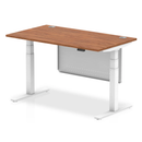 Dynamic Air 800mm deep height adjustable desk in walnut with cable ports and steel modesty panel.