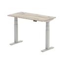 Grey oak air slimline height adjustable desk by Dynamic with cable ports and modern design.
