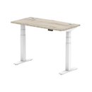 Grey oak Air Slimline height adjustable desk by Dynamic with cable ports, featuring a modern, sleek design and durable construction.