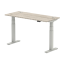 Grey oak Air Slimline height adjustable desk by Dynamic with cable ports and sleek modern design.