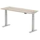 Dynamic Air Slimline adjustable desk in grey oak finish with cable ports, featuring a modern height-adjustable design.