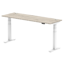 Grey oak air slimline height adjustable desk with cable ports by Dynamic, featuring a modern design and sleek profile.