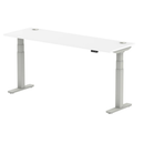 White Dynamic Air Slimline height adjustable desk with cable ports, featuring a sleek modern design and adjustable height.