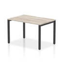 Dynamic Evolve Plus Single Starter Bench Desk in Grey Oak featuring a sleek, modern design with a sturdy tabletop and minimalist style.