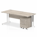 Dynamic Impulse cantilever straight desk with two-drawer mobile pedestal in grey oak finish, featuring a modern workspace setup.