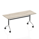 Dynamic Impulse Flip Top Table in Grey Oak with a sleek, modern design, showcasing its compact, versatile table surface.